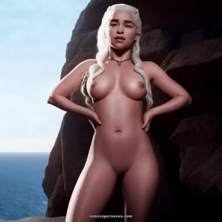 Daenerys Targaryen nue, seins pleins, tétons dressés, mains sur hanches, pubis rasé entre rochers face à la mer